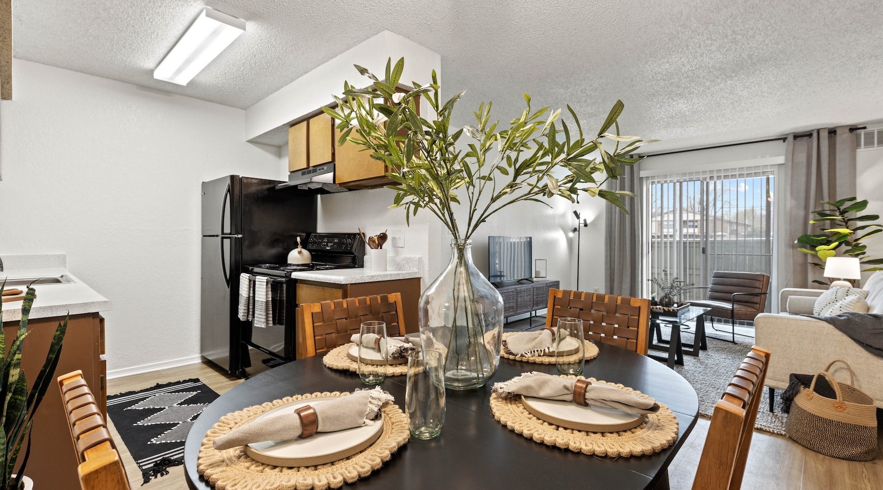 a dining room with a table and chairs