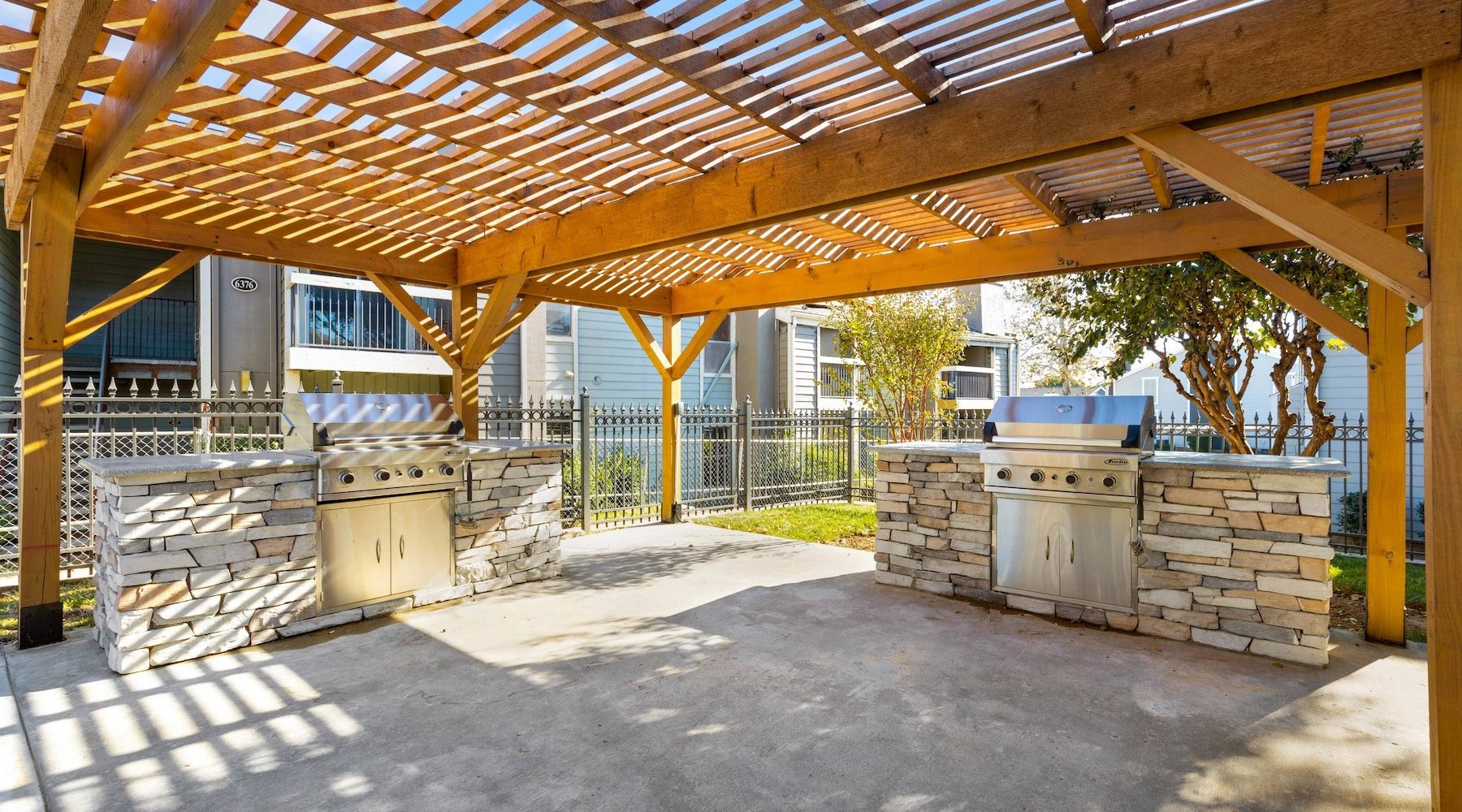 a covered patio with a brick patio