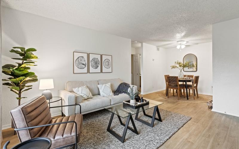 a living room with a couch and chairs