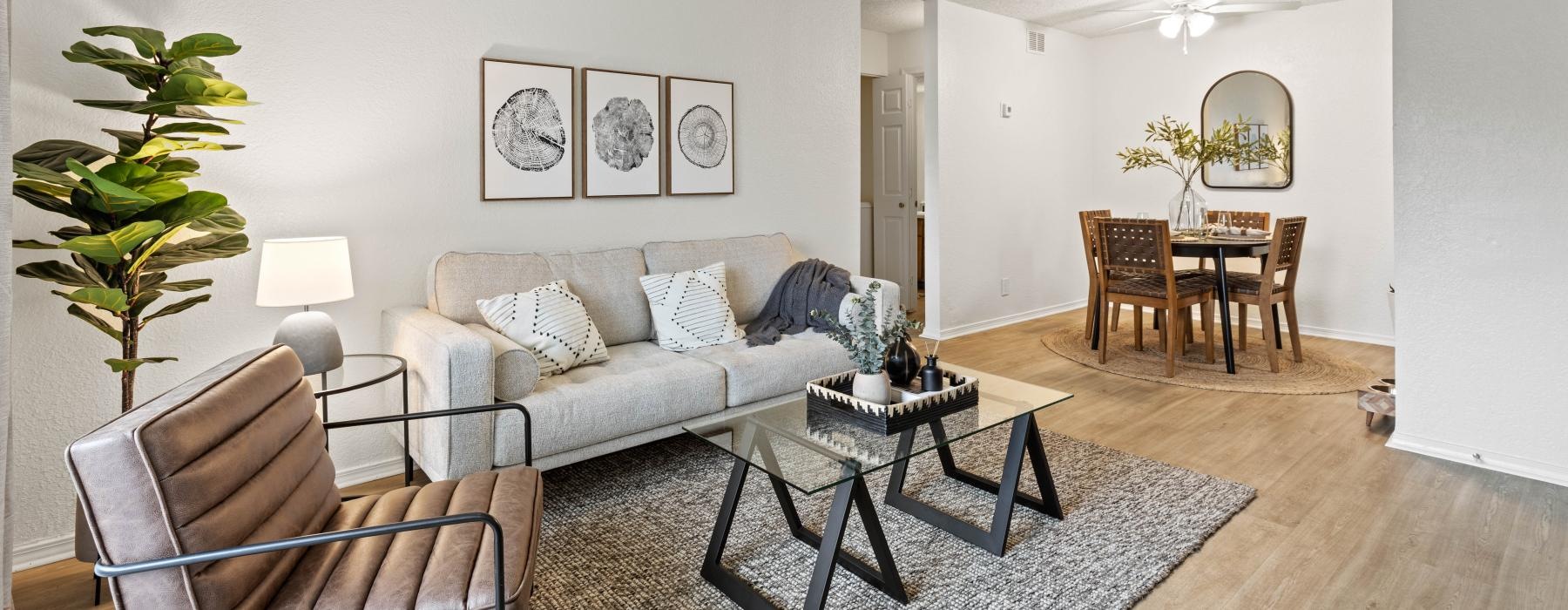 a living room with a couch and chairs